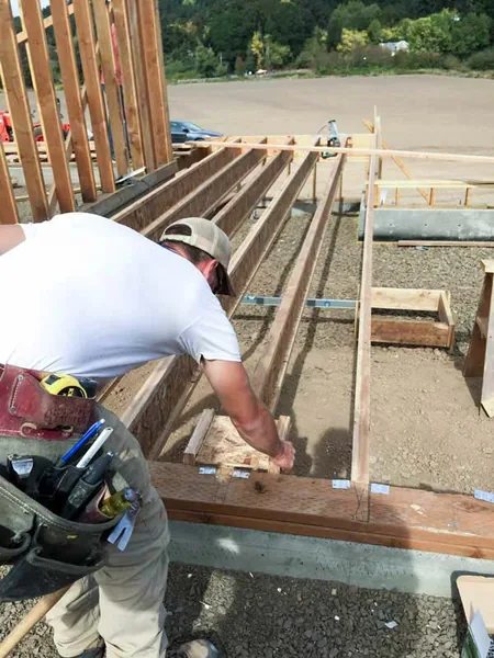Chuck Kile setting joists on a construction job site